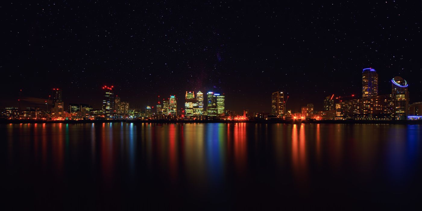 A city skyline at dusk representing a global network of verified members across markets